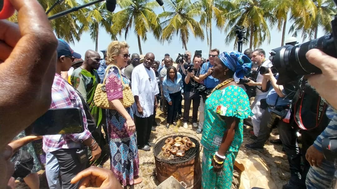 Her Majesty Queen Mathilde and Josephine Dapre Djezoro, fishmonger.